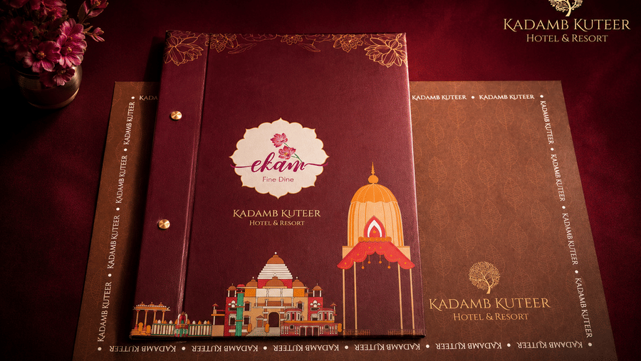 Branded restaurant menu cover with a temple illustration and gold detailing at Kadamb Kuteer, Vrindavan.