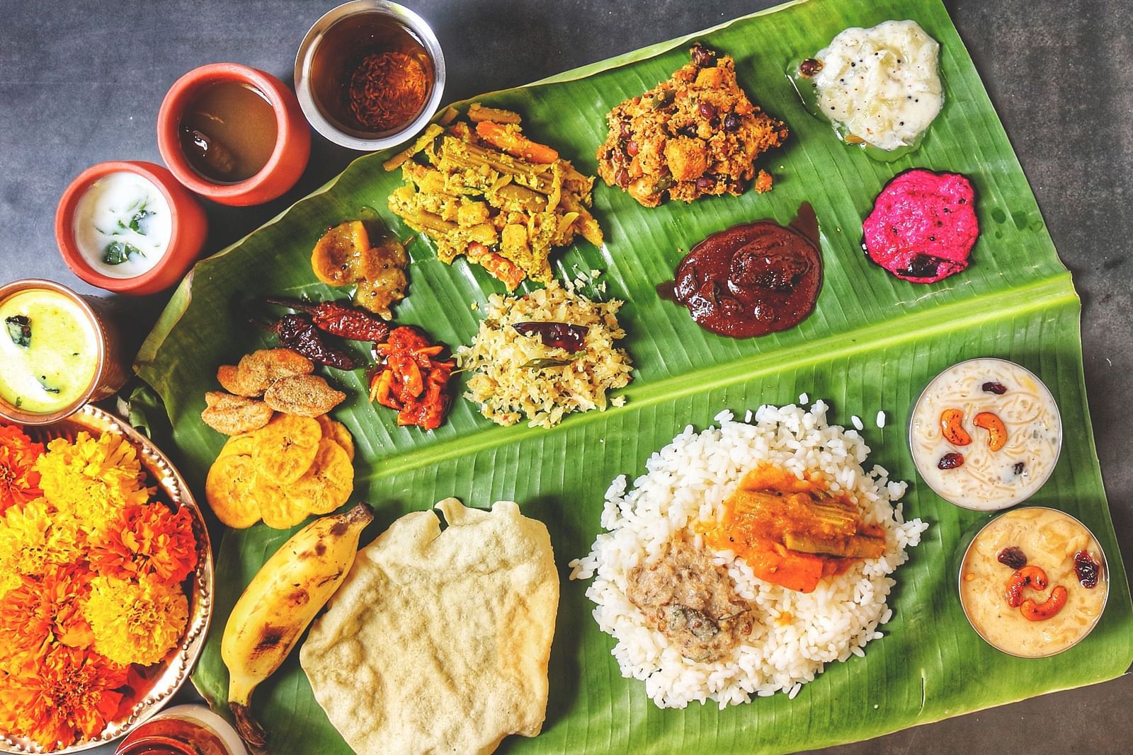 A complete Onam sadhya spread on a banana leaf