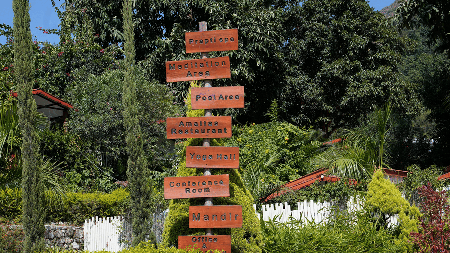 A decorated lawn with a wide rocks placed on each other to form a pillar at Neer Ganga.