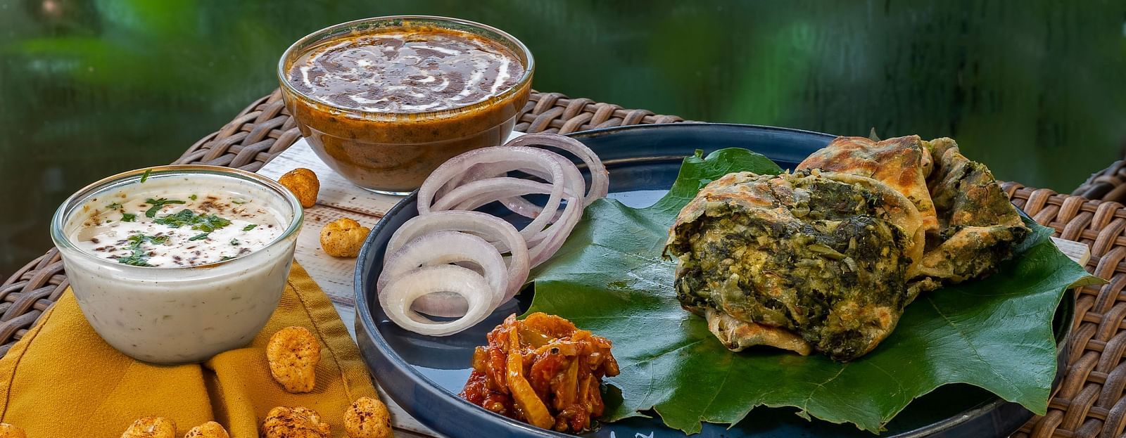 A delicious spread of Indian dishes, including thali, chaat, and desserts.