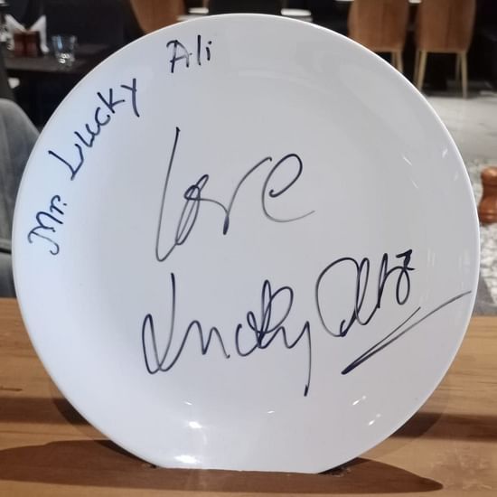 a plate with writing on it