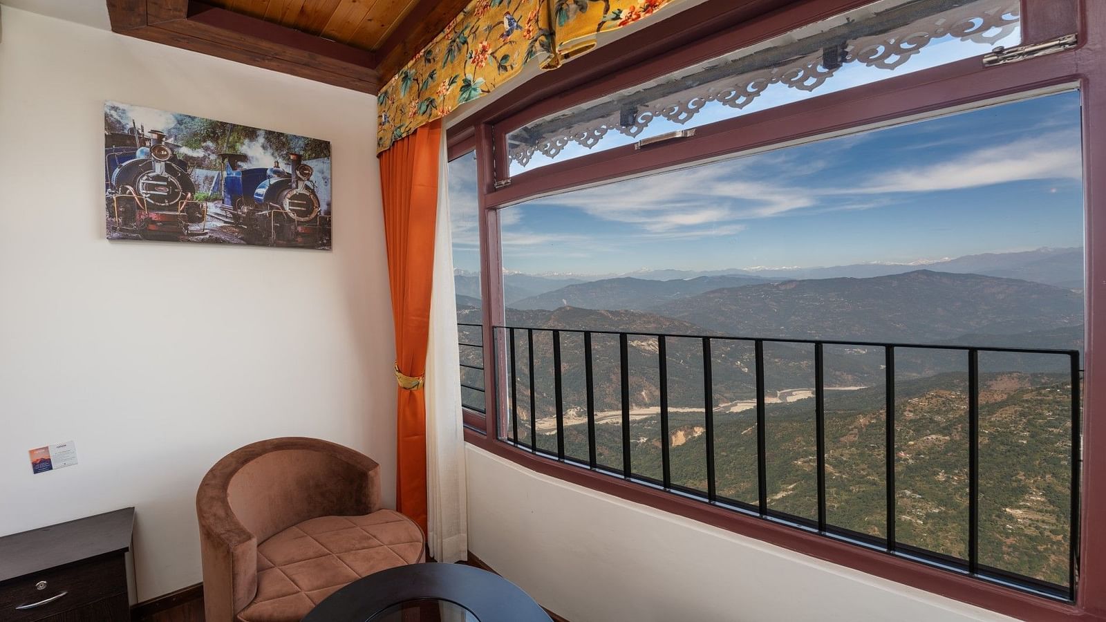 Image of a sitting area with view of the lush mountians at Summit Sherpa Mountain Hotel & Spa, Kalimpong