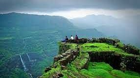 a panoramic view of a view point with people standing on top of it