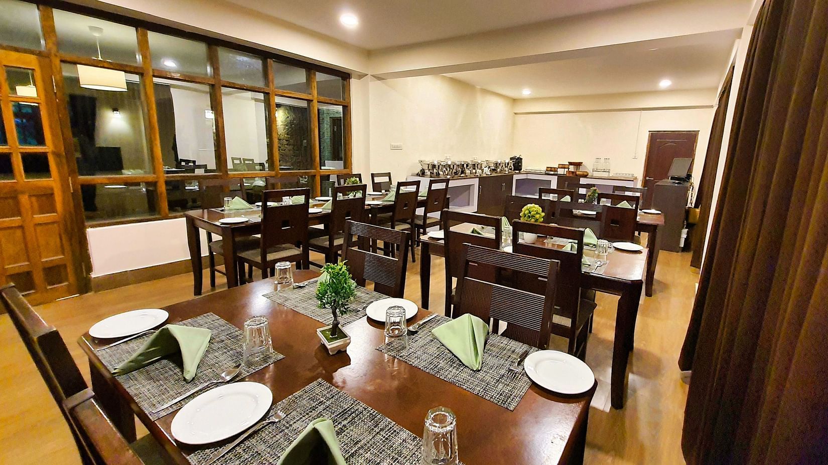 Dream Villa Retreat, Pelling - A neatly arranged table with crockery placed on it at our restaurant