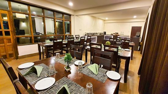 Dream Villa Retreat, Pelling - Crockery kept on the table in the interiors of our restaurant in Pelling