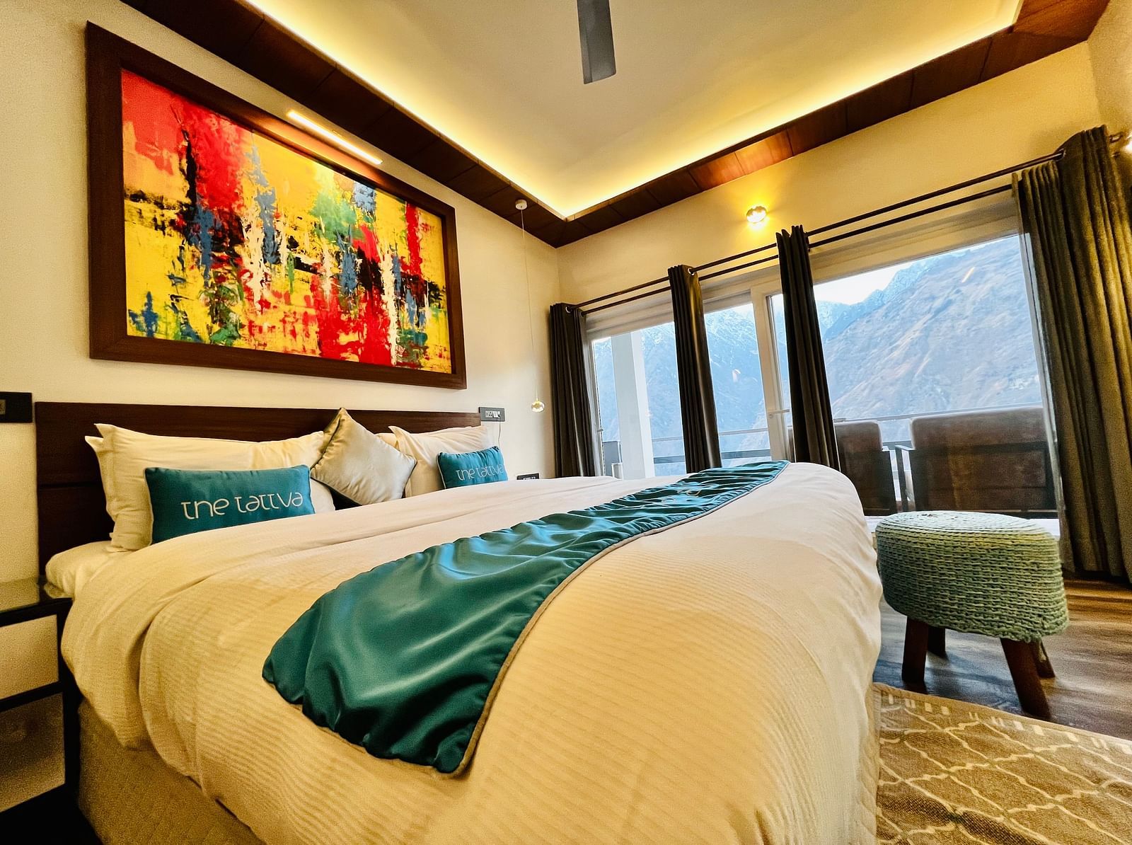 image of a double bed taken from a lower angle at the pent house - The Tattva Boutique Resort