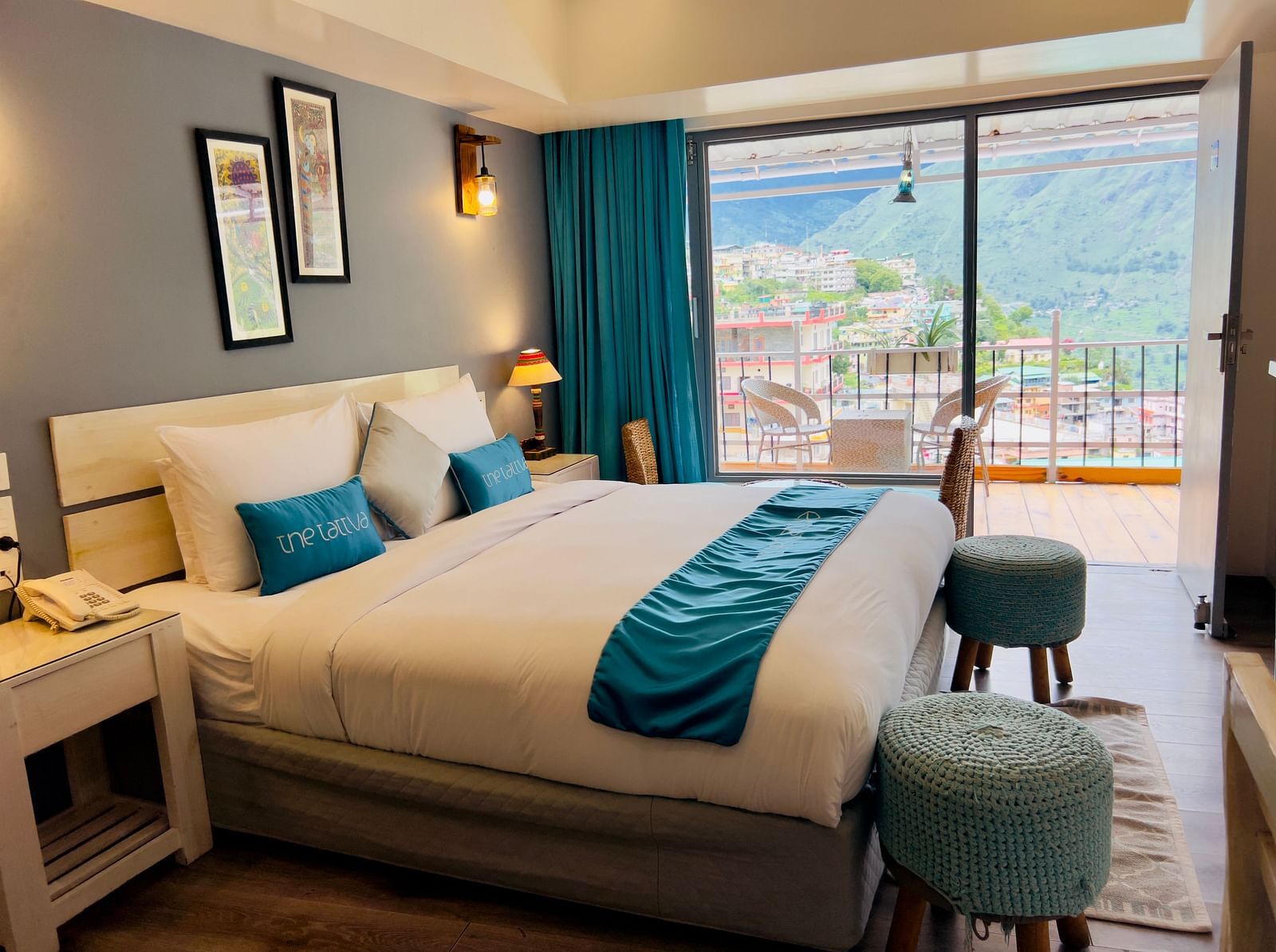 image featuring a plush double bed in the premium room with an amazing valley view - The Tattva Boutique Resort