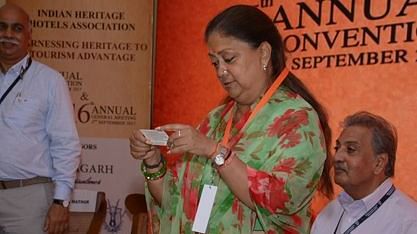 A woman examining a small card at a convention