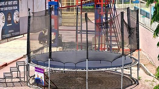 Outdoor trampoline enclosed with safety netting in a public park |  Diamond Parks, Pune 