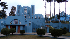 exterior facade of a Cathedral of Mary Help of Christians with its blue paint in view