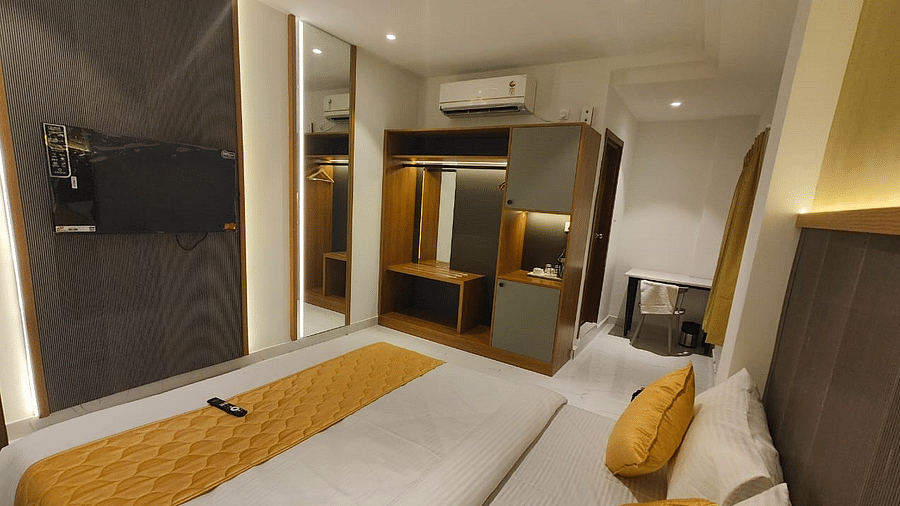 a view of the king sized bed of the room at hotel La Premier 