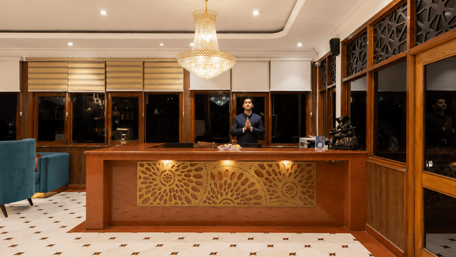 Elegant reception area with warm interiors at Pride Ashiyana Resort Mussoorie.