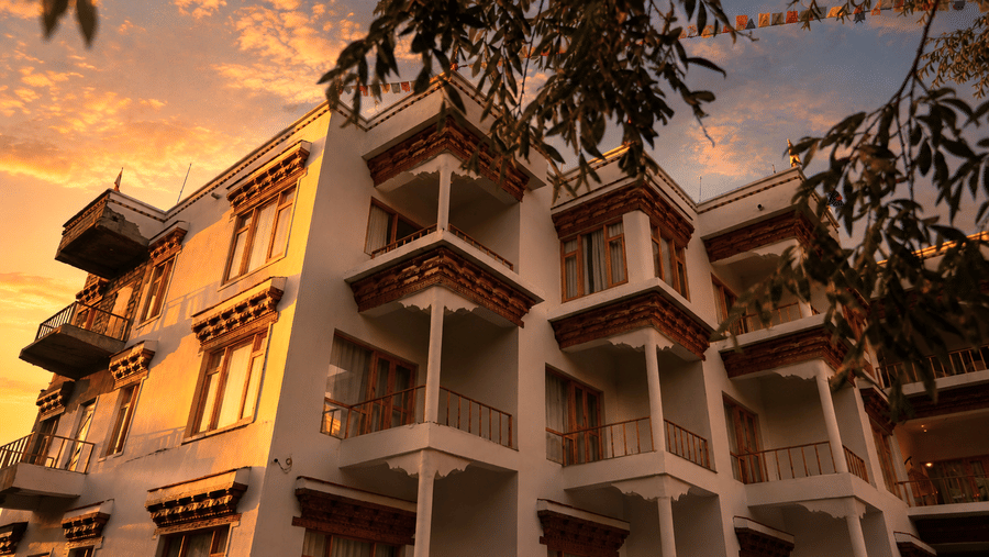 A multi-storeyed building with sky in the backdrop in the evening. | Indus Serinity, Leh Ladakh