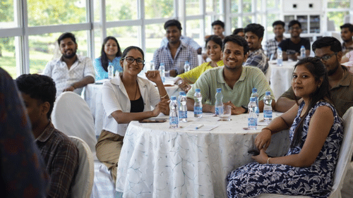Corporate team having a networking lunch during a company outing at MGM Beach Resorts, Chennai.