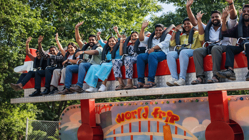 Corporate group participating in an outdoor team building game at MGM Beach Resorts, Chennai.