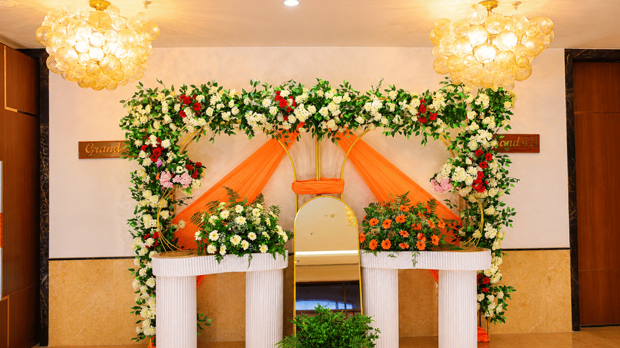The decorative floral backdrop setup for wedding or event celebrations inside the banquet hall at Ambrosia Sarovar Portico, Haridwar.