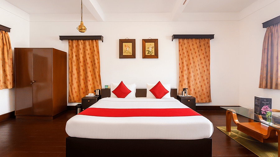 Club King Room at one of the hotels in Darjeeling with mountain views and classic interiors.