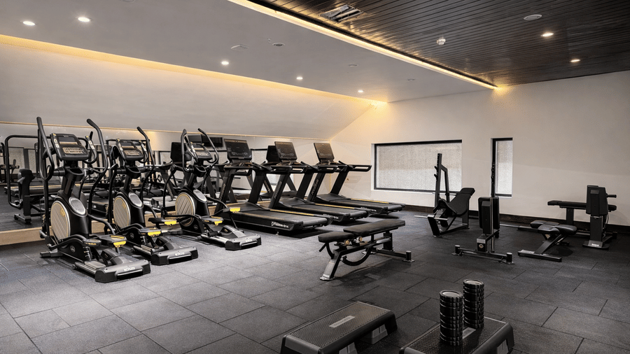 Treadmills and cycling machines placed in the gym of Mountnoor Sarovar Premiere, Pahalgam.