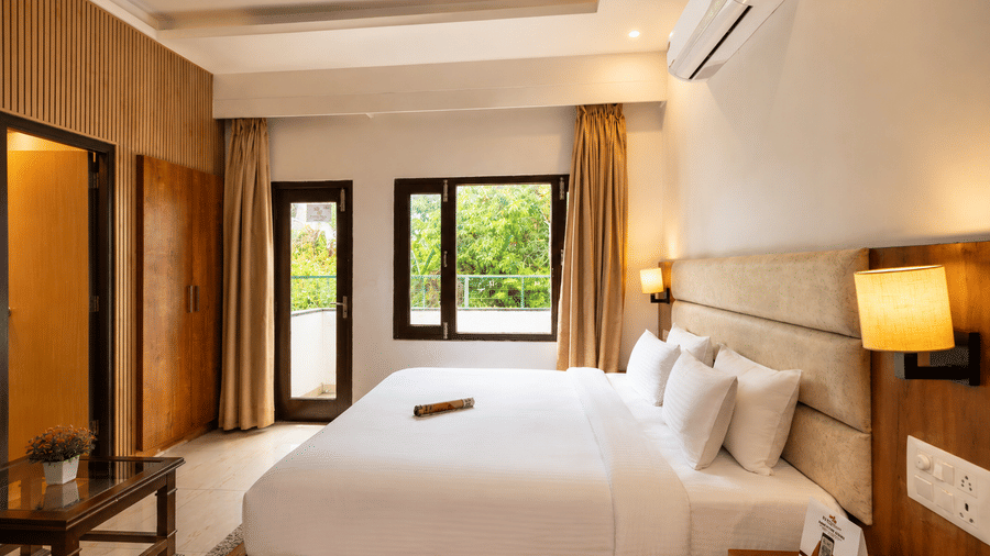 Spacious deluxe room with modern interiors at Pride Ashiyana Resort Mussoorie.