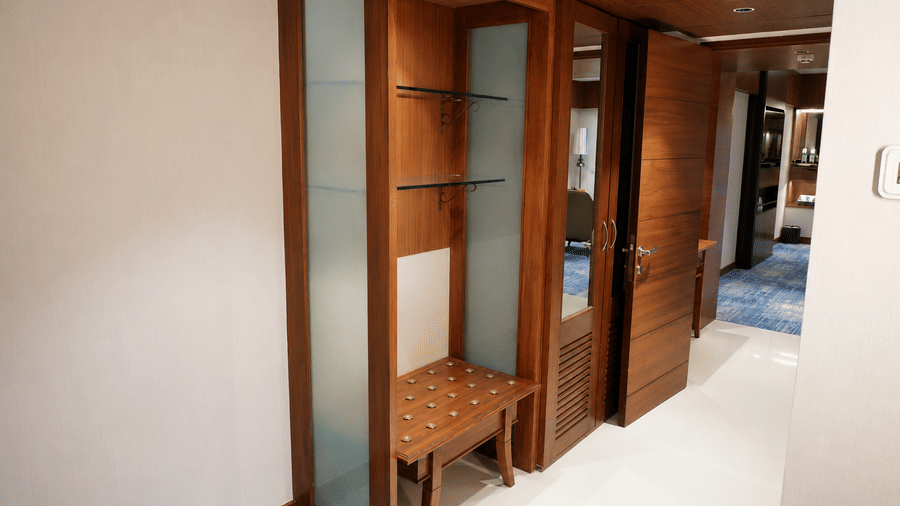 Celebrity Suite at Pride Premier Pune featuring a wardrobe with several compartments and a mirror.