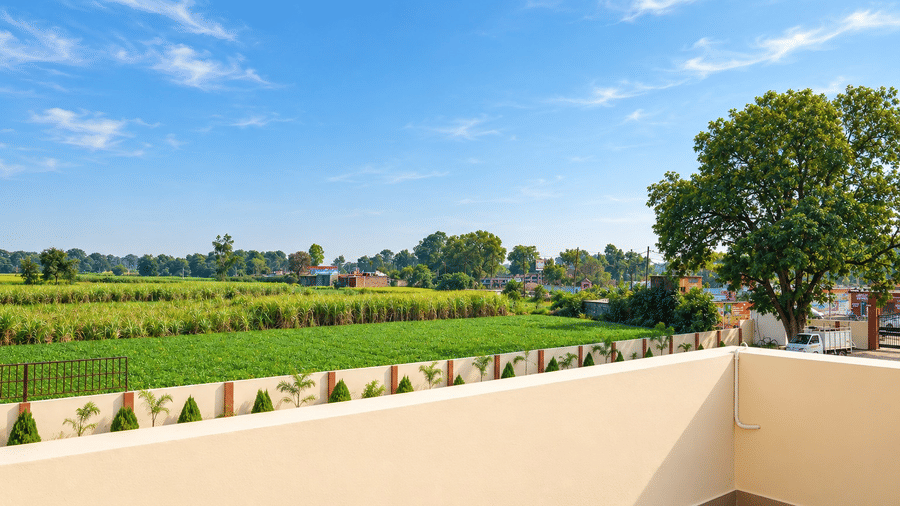  Open terrace overlooking green fields and the surrounding countryside.