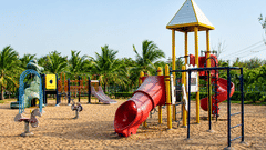 Play Area with colorful slides and climbing structures at Chariot Beach Resort, offering a fun and safe space for children to enjoy.