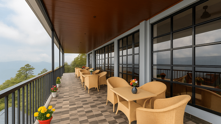 A scenic outdoor dining terrace at Summit Enigma Resort & Spa overlooks a mountainous landscape, featuring several tables with wicker chairs and potted flowers.