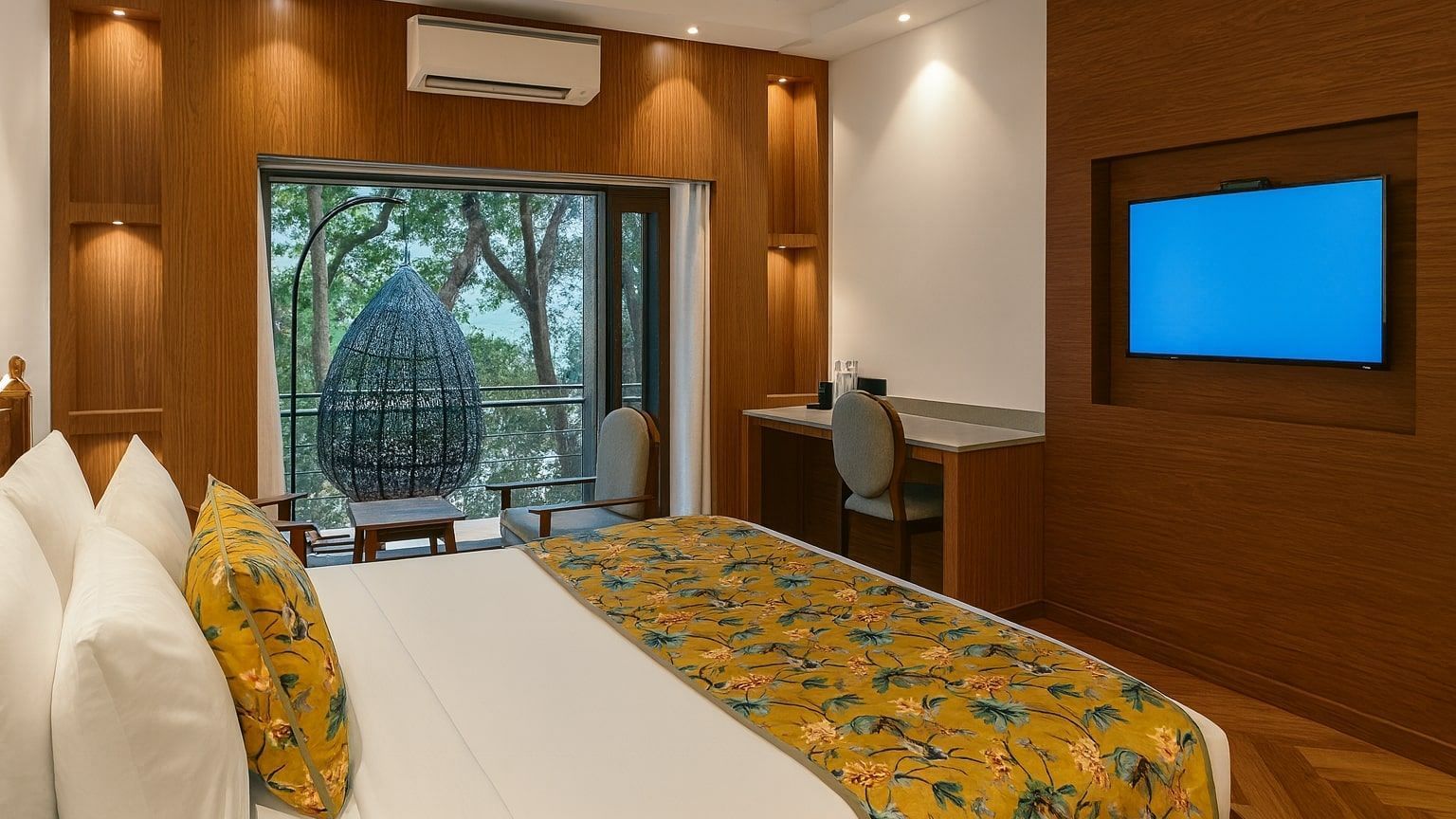 Premium Ganges View Room with Bathtub at Summit by the Ganges Beach Resort and Spa, Rishikesh showcasing a bed, a work desk and chair, an AC, a flat TV screen, and a balcony attached.
