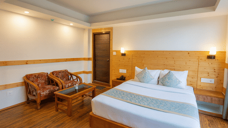Deluxe hotel room in Gangtok with wooden interiors