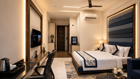 Club Room at Lords Swastik Studio, Kodinar with a king-size bed, stylish décor, work desk, seating area, and modern amenities.