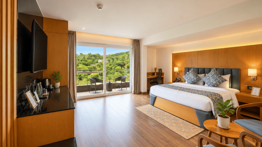 A bright master bedroom suite with large windows at BluSalzz Collection - Casa Onze, Arpora.