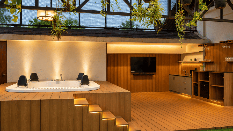 A cosy indoor hot tub area on a wooden deck at BluSalzz Collection - Casa Onze, Arpora.
