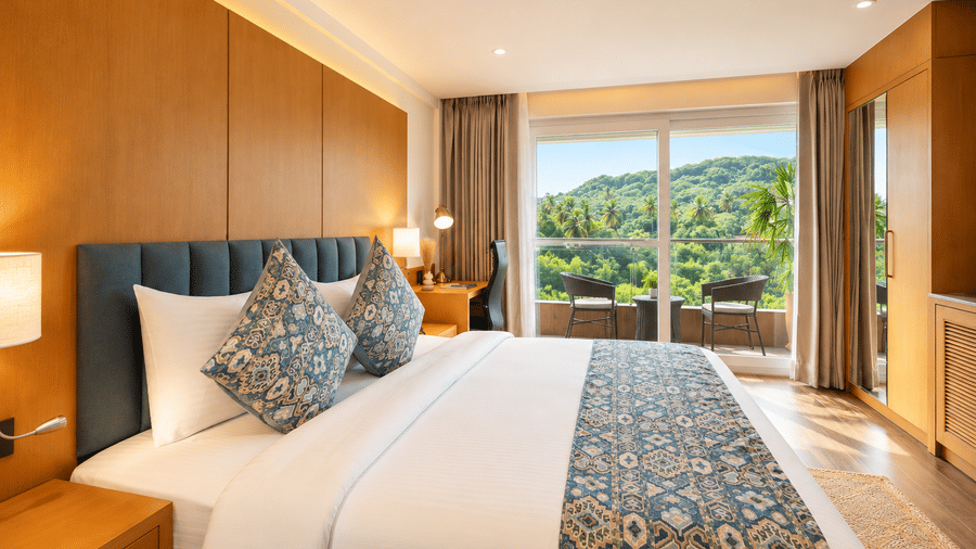 A bright guest bedroom offering scenic hill views at BluSalzz Collection - Casa Onze, Arpora.