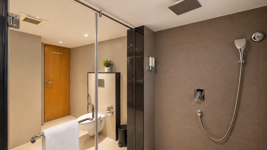 A sleek modern shower area with rain shower head at BluSalzz Collection - Casa Onze, Arpora.