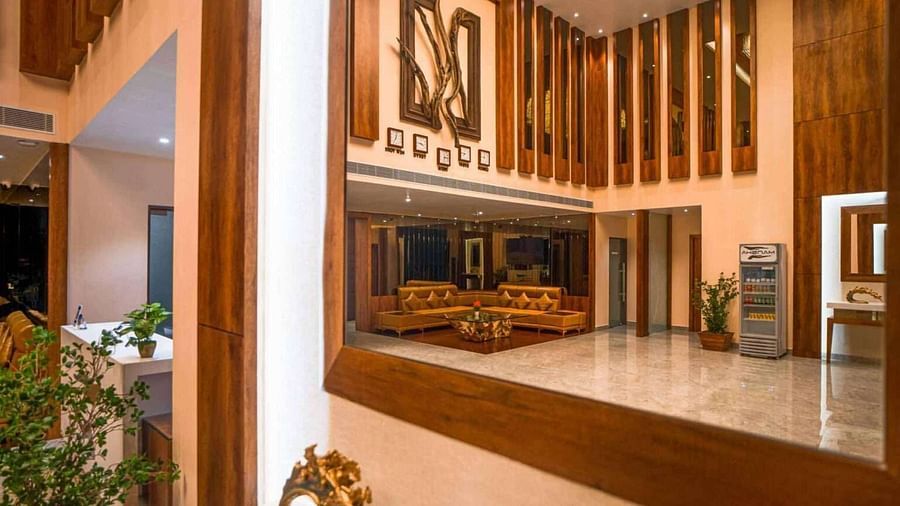The elegant lobby of Mansha Palace features warm wooden accents, comfortable seating, and a welcoming ambience.