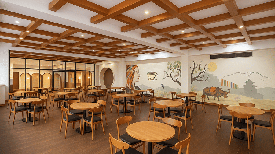 An interior of a warm and inviting dining room featuring wooden tables and chairs, decorative wood ceiling paneling, and a large wall mural in a hotel in Sikkim.