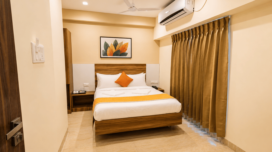 Contemporary room at Urban Comforts featuring elegant interiors, warm lighting, and comfortable bedding for a relaxing stay