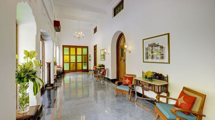 Lobby area of Saraca Hotel, Lucknow with sofa seating in the open corridor 