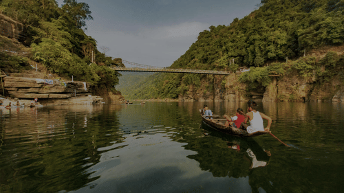 a person boating across a river