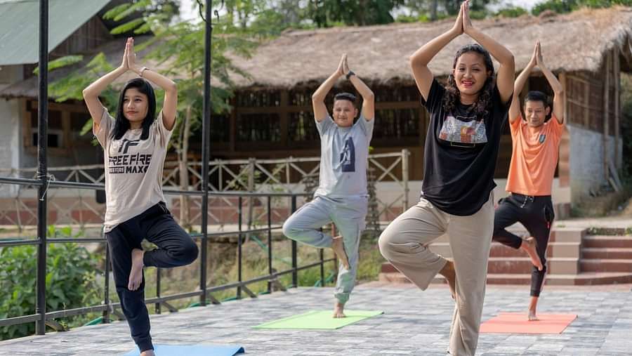 People doing yoga at Summit Green Lake Tea Resort & Spa, Kaziranga