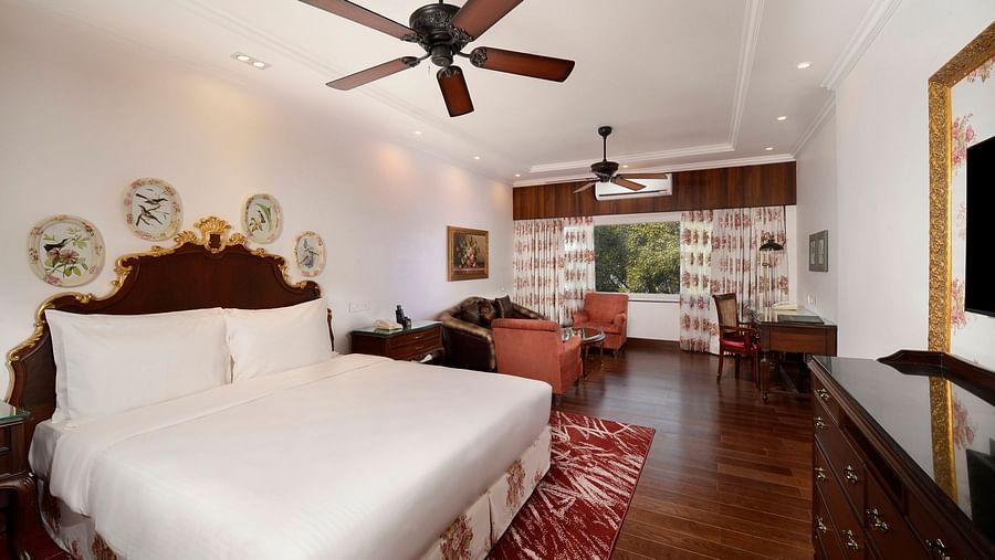 a king size bed facing the TV - Mayfair Himalayan Spa Resort Kalimpong 1