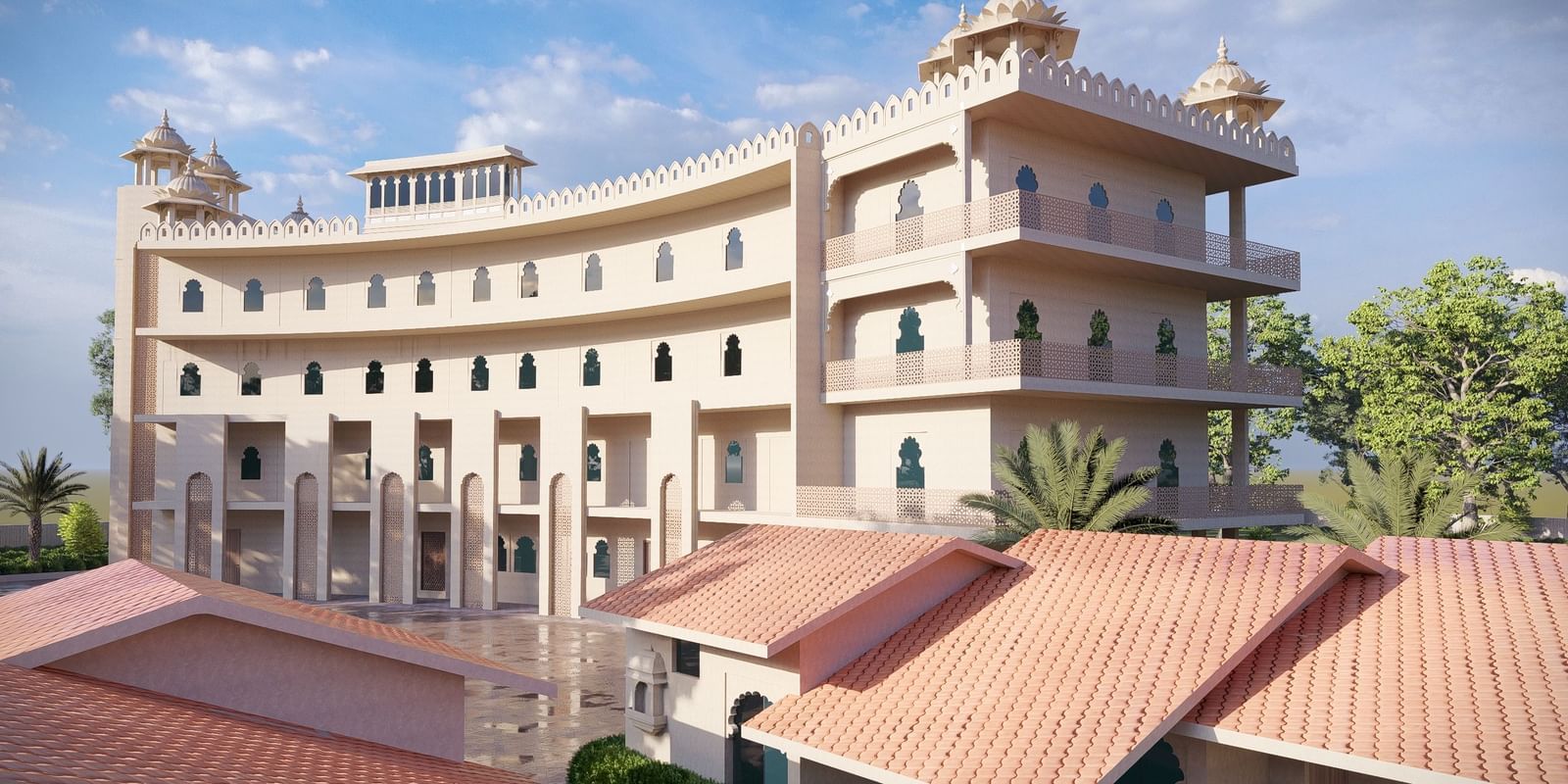 Curved exterior of the large, multi-storey Bamboo Saa Sunrise Wedding & Wellness Resort, Jaipur, with a terracotta-tiled roof in the foreground.
