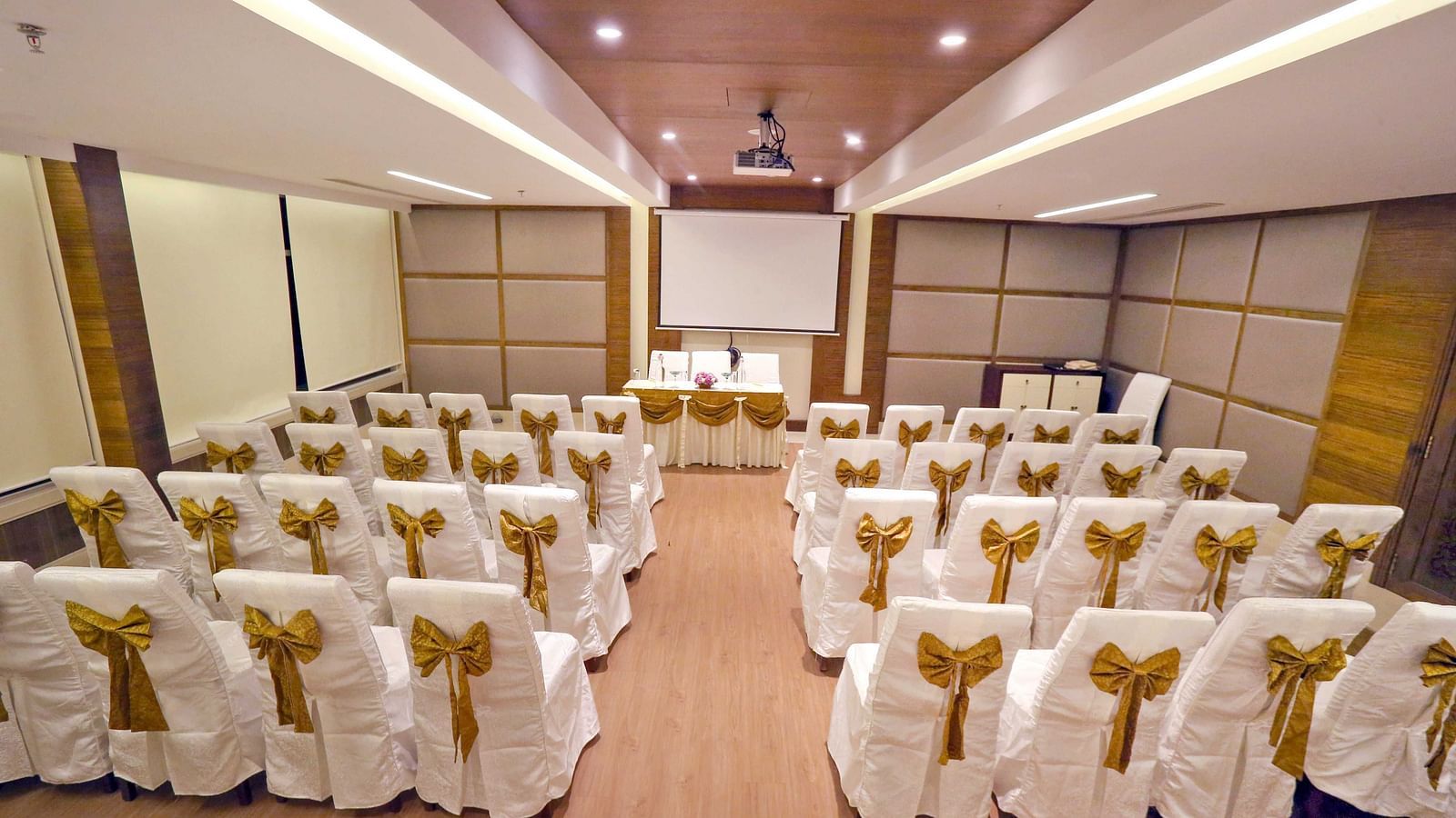  Banquet hall at Fragrant Nature Munnar, elegantly decorated with chairs and celebratory adornments