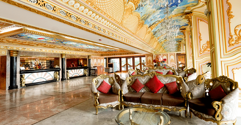 Seating area at Sitara Luxury Hotel in Hyderabad near Ramoji Film City with sofas and painted celings