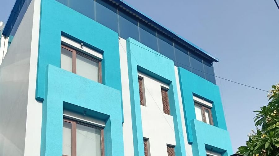 A modern building with balconies and a flat roof - Asian Suites IFFCO Chowk Metro Station, Gurgaon. 