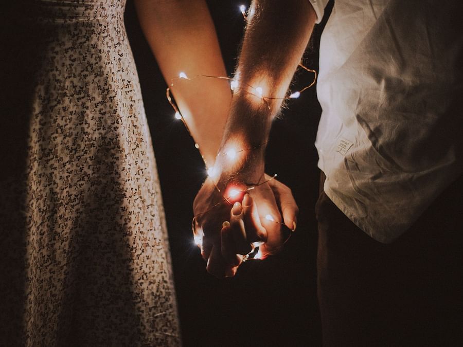 Couple's hands wrapped in fairytale