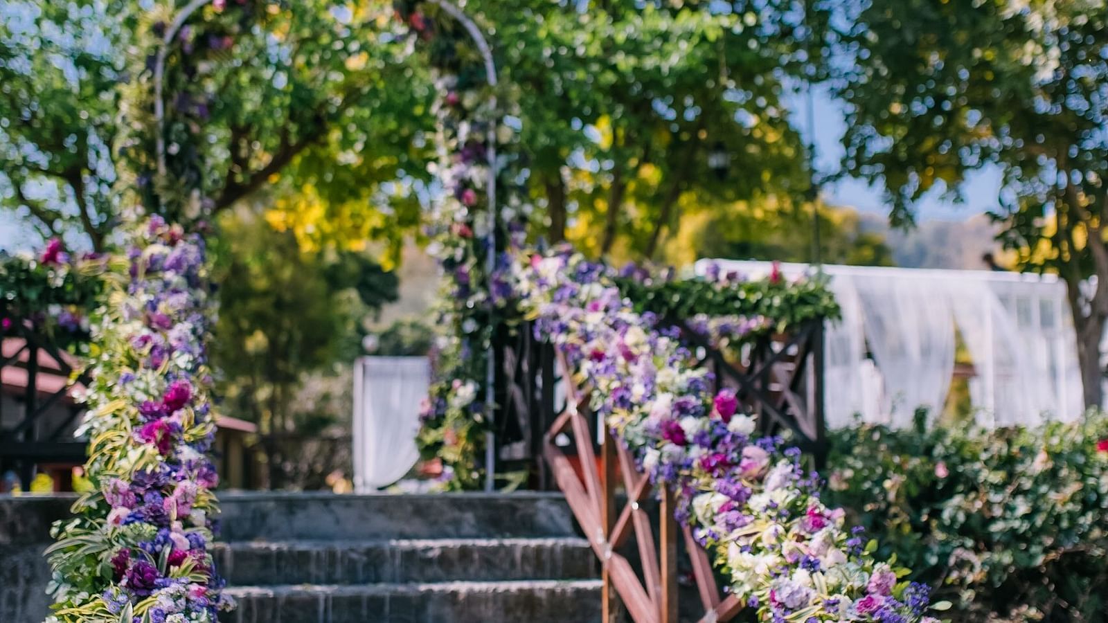 An image of a flight of stairs decorated with flowers