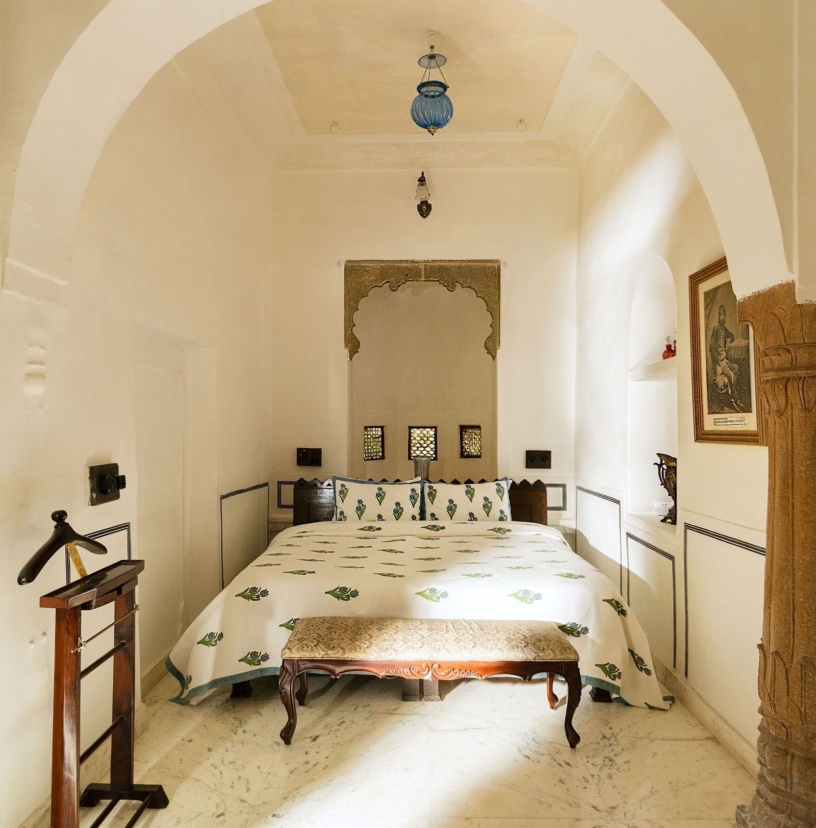 A room with a double bed and a suit hanger at Fort Barli, Ajmer