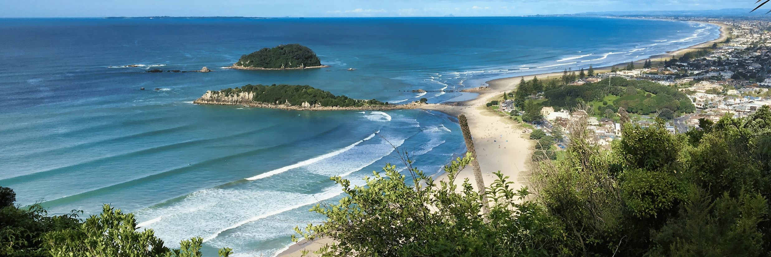 A vibrant, brightly lit casino room filled with rows of slot machines and other gambling games.