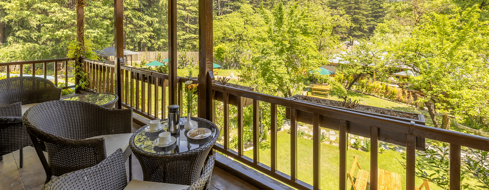 Balcony with a view of the mountains at The Riverview Retreat, Corbett.
